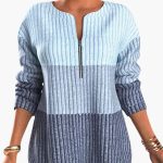 Women's pullover with zip neckline and ribbed surface